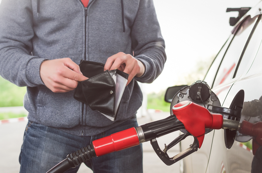 person pumping gas