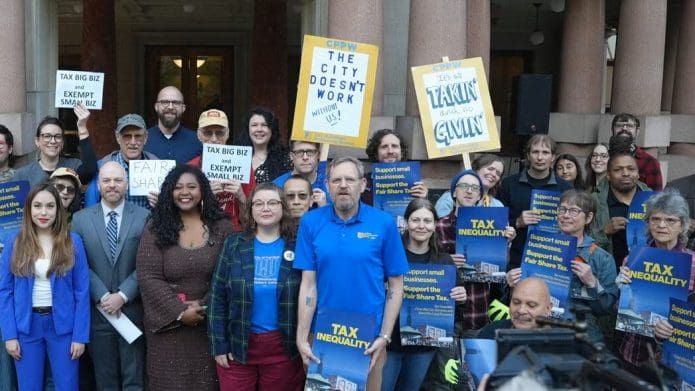 Supporters of the "Fair Share Tax" outside Portland City Hall, October 8, 2026.